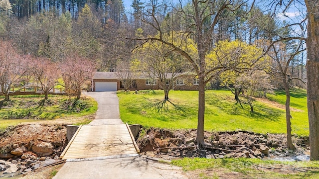 6334 Jacks Creek Rd, Burnsville, NC 28714 - view of front of property with asphalt driveway, an attached garage, and a front lawn