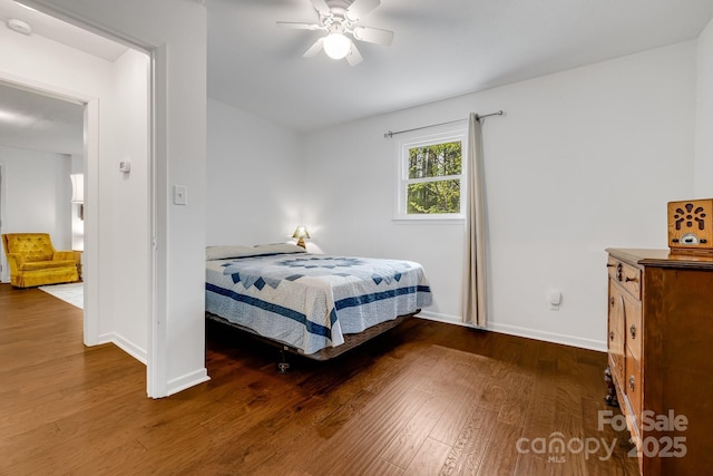 6334 Jacks Creek Rd, Burnsville, NC 28714 - bedroom featuring baseboards, wood finished floors, and ceiling fan