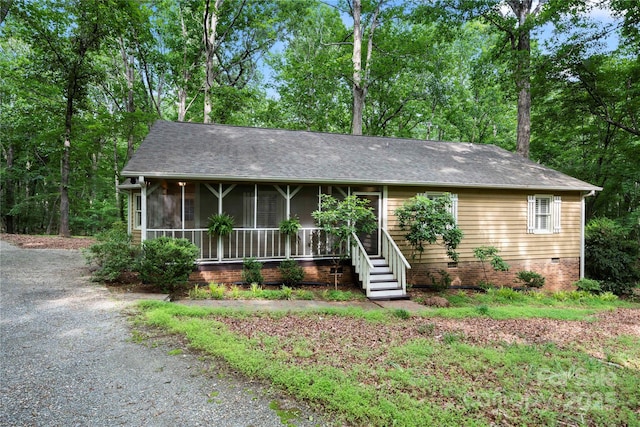 single story home featuring a shingled roof and crawl space
