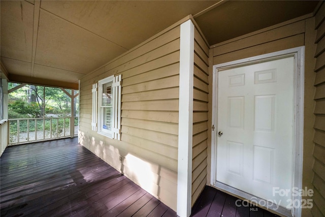 doorway to property with a porch