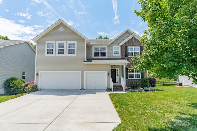 7650 W Berkeley Rd, Denver, NC 28037 - view of front of house with an attached garage, concrete driveway, a front yard, brick siding, and central AC