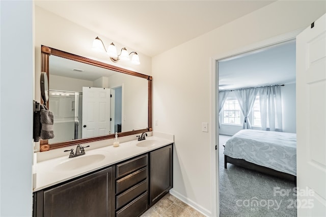 7650 W Berkeley Rd, Denver, NC 28037 - bathroom featuring double vanity, baseboards, and connected bathroom