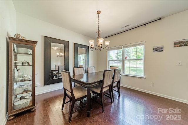 7650 W Berkeley Rd, Denver, NC 28037 - dining area featuring a chandelier and dark wood-type flooring