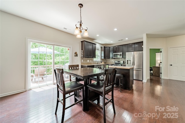 7650 W Berkeley Rd, Denver, NC 28037 - dining room with hardwood / wood-style flooring, a chandelier, and recessed lighting