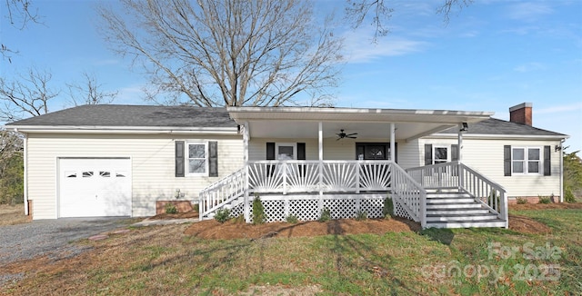 12491 Oak Grove Rd, Stanfield, NC 28163 - ranch-style home with a porch, ceiling fan, an attached garage, a chimney, and a front lawn