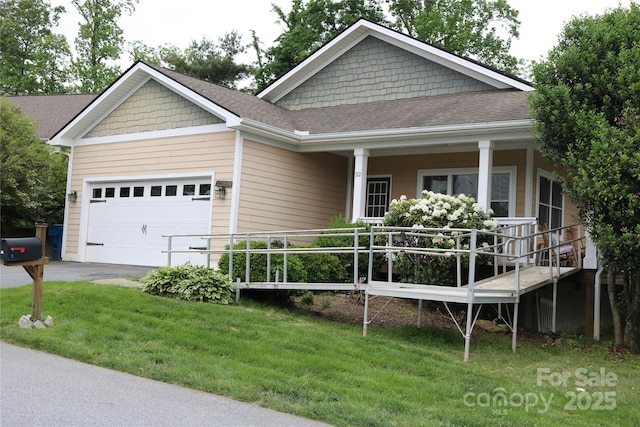 view of front of home with a garage, a front lawn, driveway, covered porch, and roof with shingles