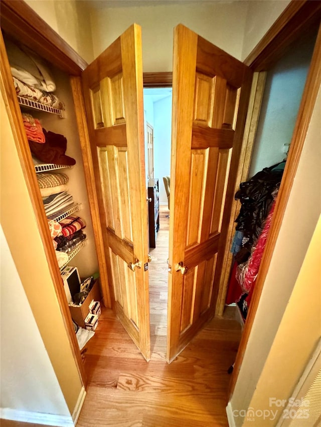 hallway featuring light wood-style floors
