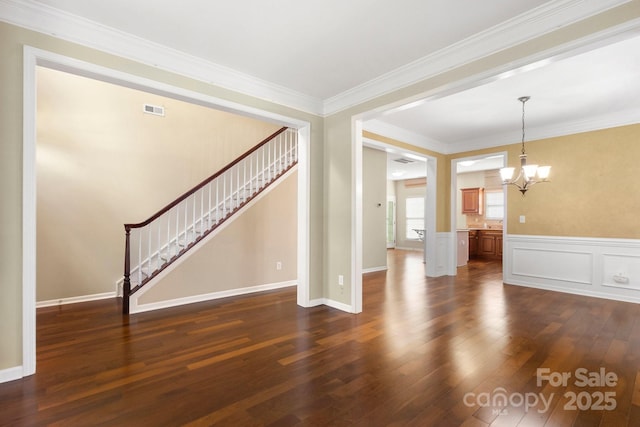 12824 Harvest Time Ct, Charlotte, NC 28278 - unfurnished living room featuring a chandelier, dark wood finished floors, stairway, wainscoting, and crown molding