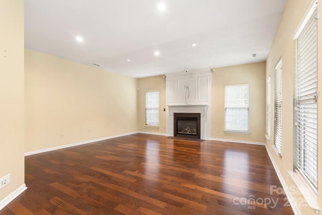 12824 Harvest Time Ct, Charlotte, NC 28278 - unfurnished living room featuring wood finished floors, a fireplace, recessed lighting, and baseboards