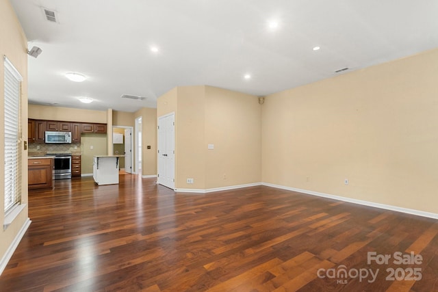 12824 Harvest Time Ct, Charlotte, NC 28278 - unfurnished living room with dark wood finished floors, baseboards, and recessed lighting