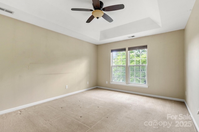 12824 Harvest Time Ct, Charlotte, NC 28278 - empty room featuring baseboards, carpet, a raised ceiling, and a ceiling fan