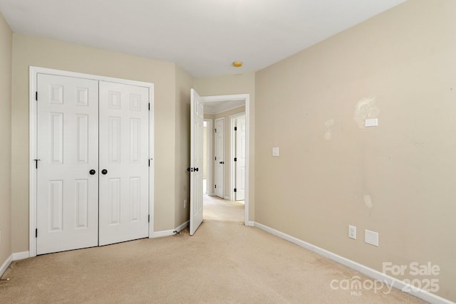 12824 Harvest Time Ct, Charlotte, NC 28278 - unfurnished bedroom with light carpet, baseboards, and a closet