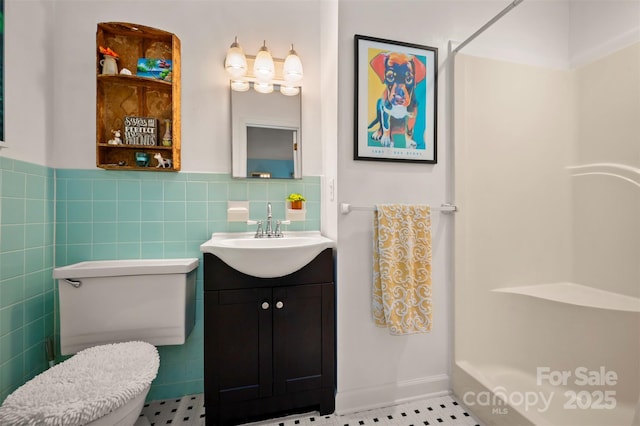 1761 Oak Grove Church Rd, Ellenboro, NC 28040 - bathroom featuring vanity, a shower, toilet, tile patterned floors, and tile walls