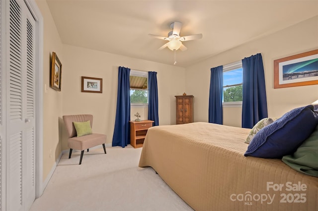 1761 Oak Grove Church Rd, Ellenboro, NC 28040 - bedroom with multiple windows, light carpet, a closet, and ceiling fan