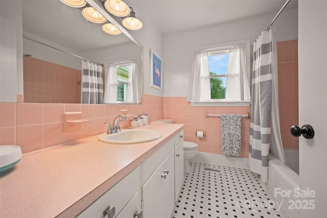 1761 Oak Grove Church Rd, Ellenboro, NC 28040 - bathroom featuring vanity, tile patterned floors, toilet, shower / bathtub combination with curtain, and tile walls