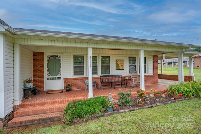 1761 Oak Grove Church Rd, Ellenboro, NC 28040 - view of exterior entry with covered porch and brick siding