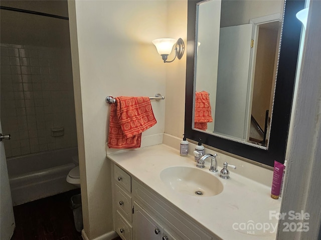 full bath with toilet and vanity