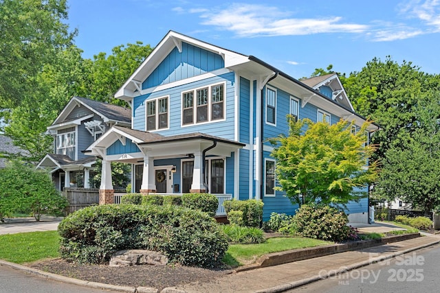 331 Solomon St, Charlotte, NC 28216 - view of front of home featuring covered porch and board and batten siding