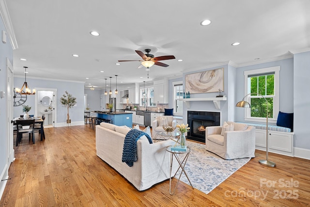 331 Solomon St, Charlotte, NC 28216 - living area featuring crown molding, recessed lighting, light wood-type flooring, ceiling fan, and baseboards