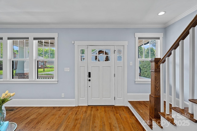 331 Solomon St, Charlotte, NC 28216 - foyer entrance featuring wood finished floors, stairway, baseboards, crown molding, and recessed lighting