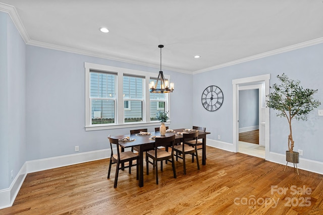331 Solomon St, Charlotte, NC 28216 - dining space with crown molding, light wood-type flooring, a chandelier, baseboards, and recessed lighting
