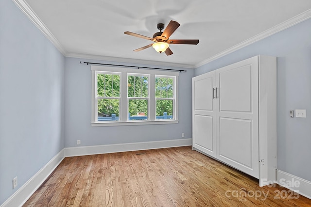 331 Solomon St, Charlotte, NC 28216 - unfurnished bedroom with light wood-style floors, crown molding, baseboards, and ceiling fan