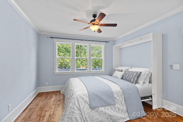 331 Solomon St, Charlotte, NC 28216 - bedroom with baseboards, wood finished floors, crown molding, and ceiling fan