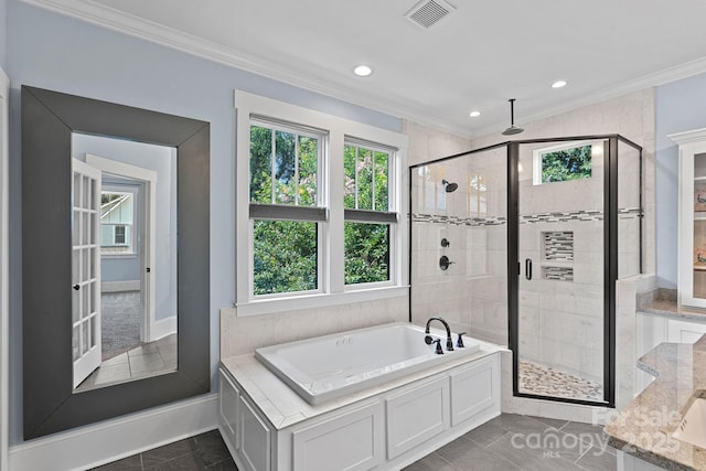331 Solomon St, Charlotte, NC 28216 - bathroom featuring healthy amount of natural light, crown molding, a stall shower, a bath, and recessed lighting