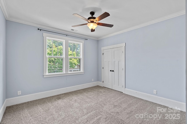 331 Solomon St, Charlotte, NC 28216 - unfurnished bedroom featuring carpet, ornamental molding, baseboards, a closet, and ceiling fan