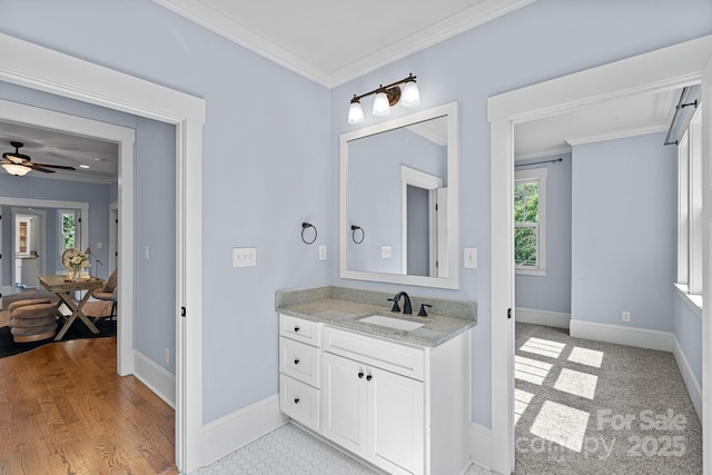331 Solomon St, Charlotte, NC 28216 - bathroom with crown molding, vanity, baseboards, and ceiling fan