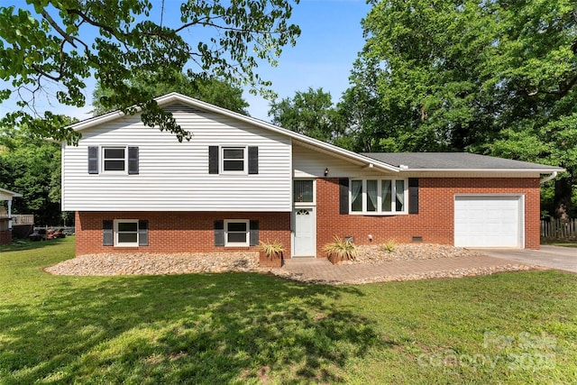 1822 N New Hope Rd, Gastonia, NC 28054 - tri-level home with concrete driveway, a garage, a front yard, and brick siding