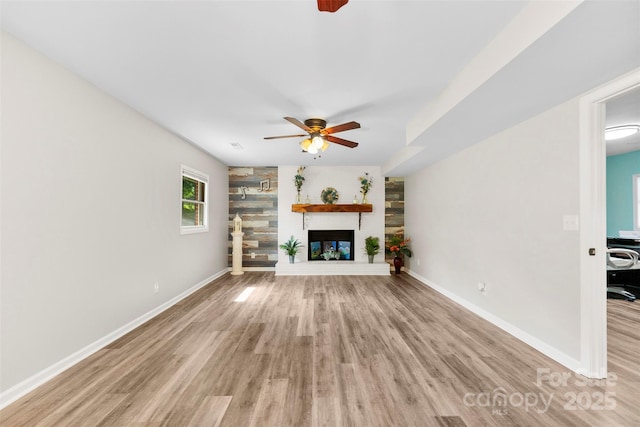 1822 N New Hope Rd, Gastonia, NC 28054 - unfurnished living room featuring light wood finished floors, ceiling fan, and baseboards