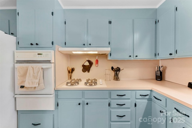 1822 N New Hope Rd, Gastonia, NC 28054 - kitchen with white appliances, under cabinet range hood, a warming drawer, light countertops, and crown molding