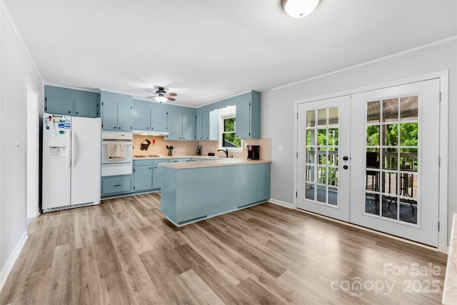 1822 N New Hope Rd, Gastonia, NC 28054 - kitchen featuring white appliances, blue cabinets, french doors, a warming drawer, and light countertops