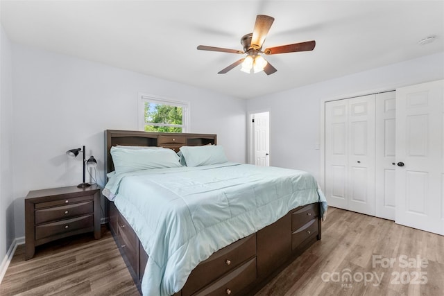 1822 N New Hope Rd, Gastonia, NC 28054 - bedroom featuring light wood-style floors, a closet, a ceiling fan, and baseboards