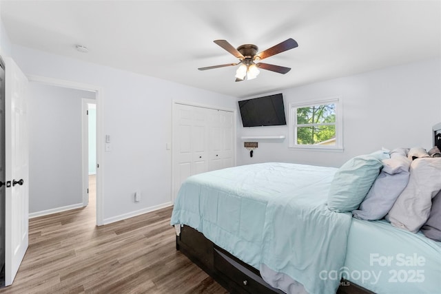 1822 N New Hope Rd, Gastonia, NC 28054 - bedroom with wood finished floors, a closet, baseboards, and a ceiling fan