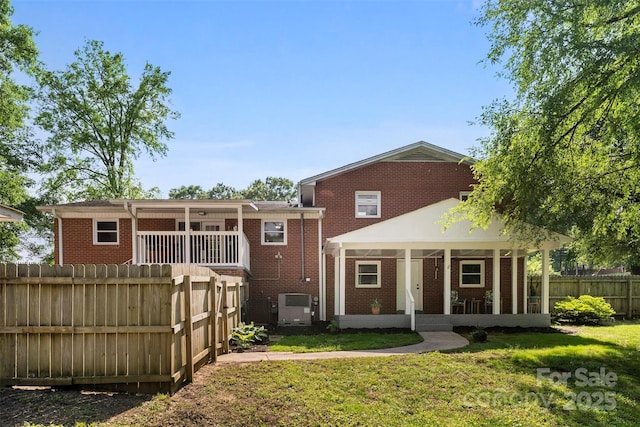 1822 N New Hope Rd, Gastonia, NC 28054 - back of property with brick siding, a sunroom, and cooling unit