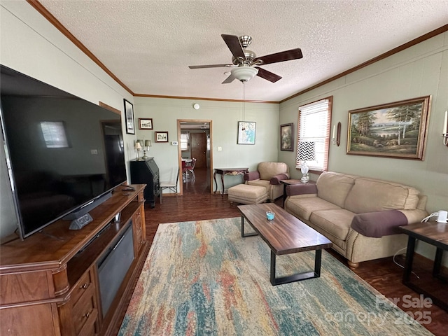 211 Spruce St, Badin, NC 28009 - living area with ornamental molding, dark wood finished floors, a textured ceiling, and a ceiling fan