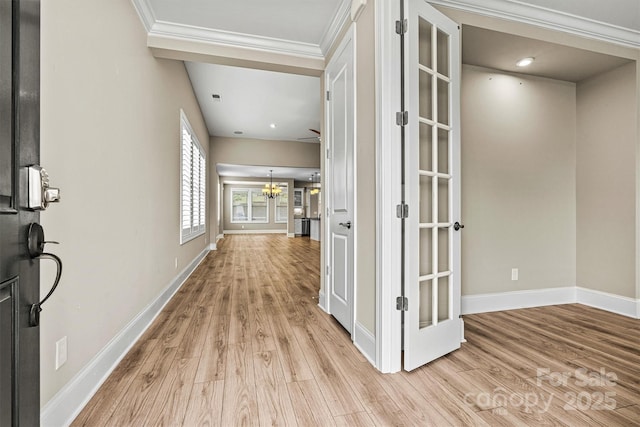 7362 Overjoyed Xing, Charlotte, NC 28215 - entryway with light wood-type flooring, baseboards, a chandelier, ornamental molding, and french doors