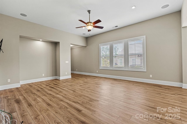 7362 Overjoyed Xing, Charlotte, NC 28215 - empty room with a ceiling fan, light wood finished floors, and baseboards