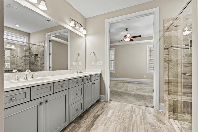 7362 Overjoyed Xing, Charlotte, NC 28215 - bathroom with double vanity, a stall shower, ceiling fan, and healthy amount of natural light