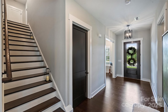 562 Preservation Dr, Fort Mill, SC 29715 - foyer entrance with stairway, a chandelier, dark wood-style flooring, and baseboards