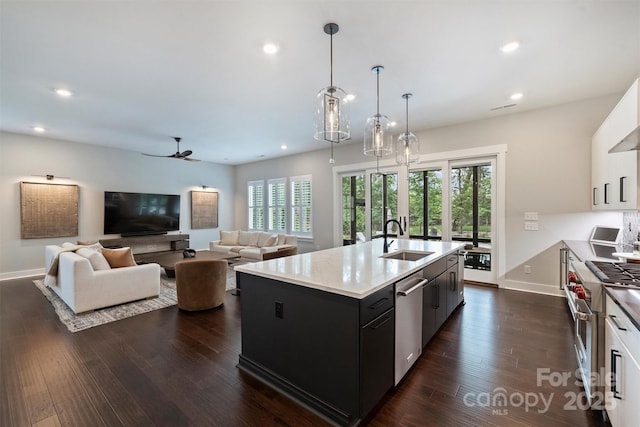 562 Preservation Dr, Fort Mill, SC 29715 - kitchen featuring appliances with stainless steel finishes, a sink, a ceiling fan, baseboards, and recessed lighting