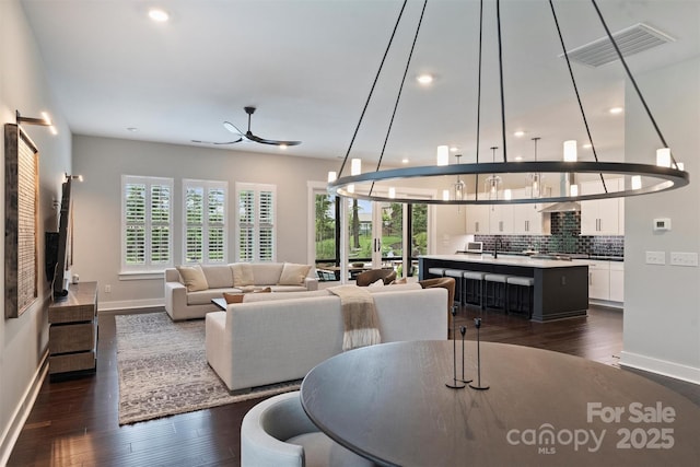562 Preservation Dr, Fort Mill, SC 29715 - living room featuring baseboards, dark wood-type flooring, recessed lighting, and ceiling fan