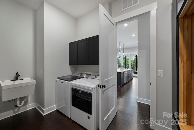 562 Preservation Dr, Fort Mill, SC 29715 - laundry room with cabinet space, washing machine and dryer, dark wood finished floors, baseboards, and recessed lighting