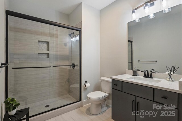 562 Preservation Dr, Fort Mill, SC 29715 - bathroom featuring toilet, a stall shower, and vanity