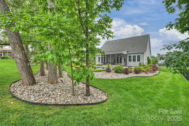 562 Preservation Dr, Fort Mill, SC 29715 - back of house featuring a sunroom and a shingled roof
