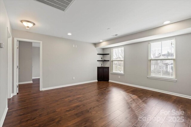 4095 Harmattan Dr, Denver, NC 28037 - unfurnished living room featuring dark wood finished floors, baseboards, and recessed lighting