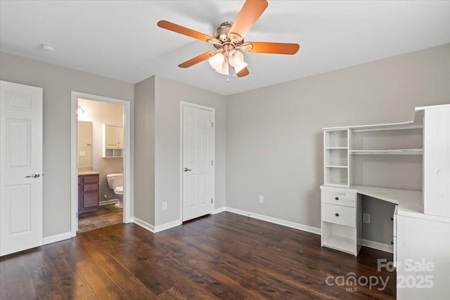4095 Harmattan Dr, Denver, NC 28037 - unfurnished bedroom with dark wood-style floors, baseboards, connected bathroom, and a ceiling fan
