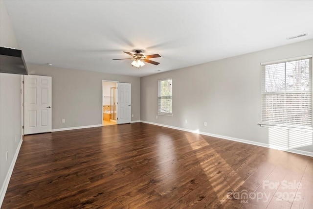 4095 Harmattan Dr, Denver, NC 28037 - spare room featuring ceiling fan, dark wood-type flooring, and baseboards